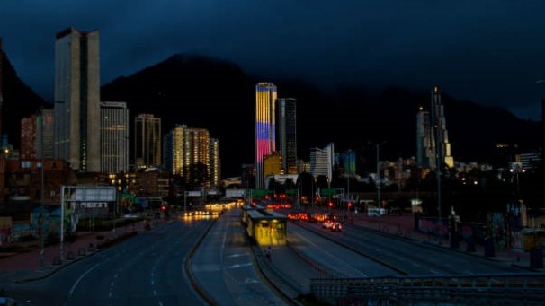 BOGOTA,COLOMBIA-JUNE 26,2016: Cityscape at night time of buildings and streets of Bogota,Colombia. On the Background the Colpatria Tower Building is iluminated with led lights.